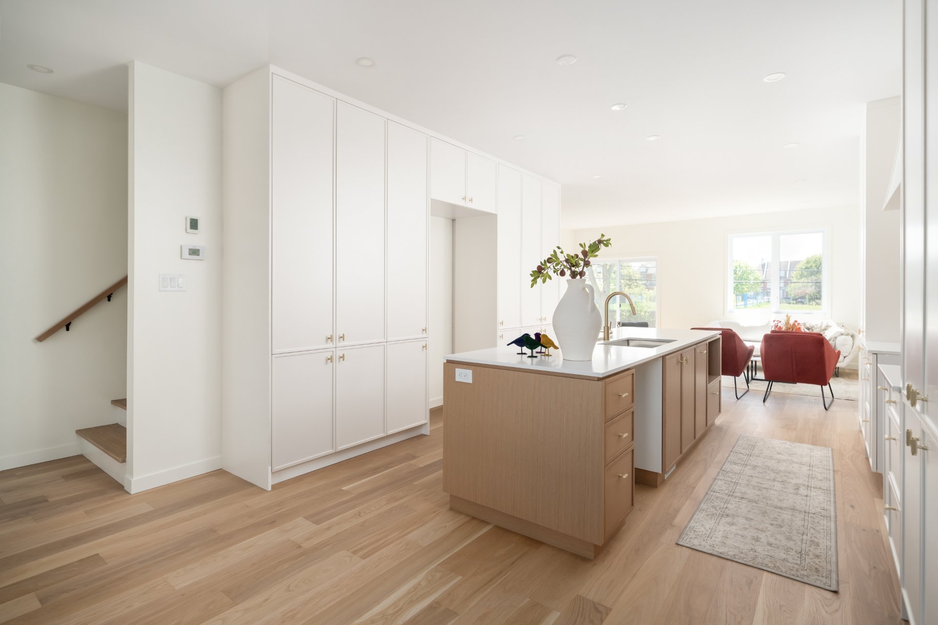 Custom kitchen with oak island and quartz counters